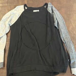 Nununu size 10-11  Black Raglan Sleeve with Circle Stitch Detail